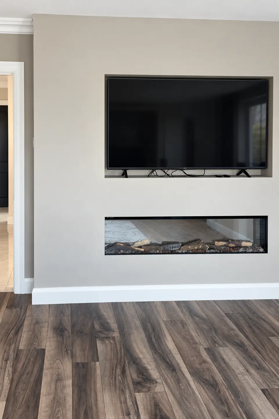 Interior media wall with inset television and fireplace